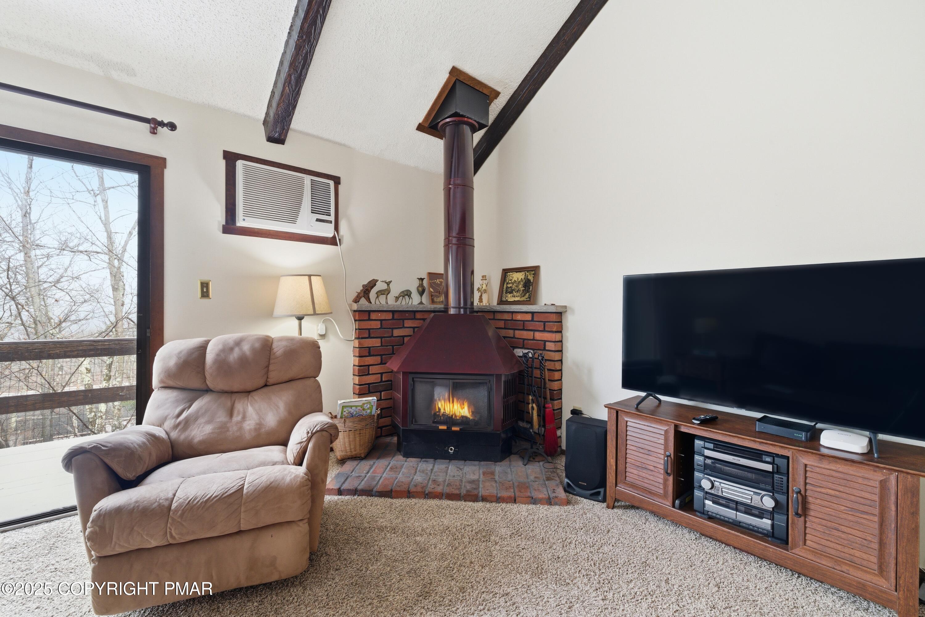 182 Upper Village Way Tannersville, PA 18372 - Photo 8 of 67 a living room with furniture and a flat screen tv
