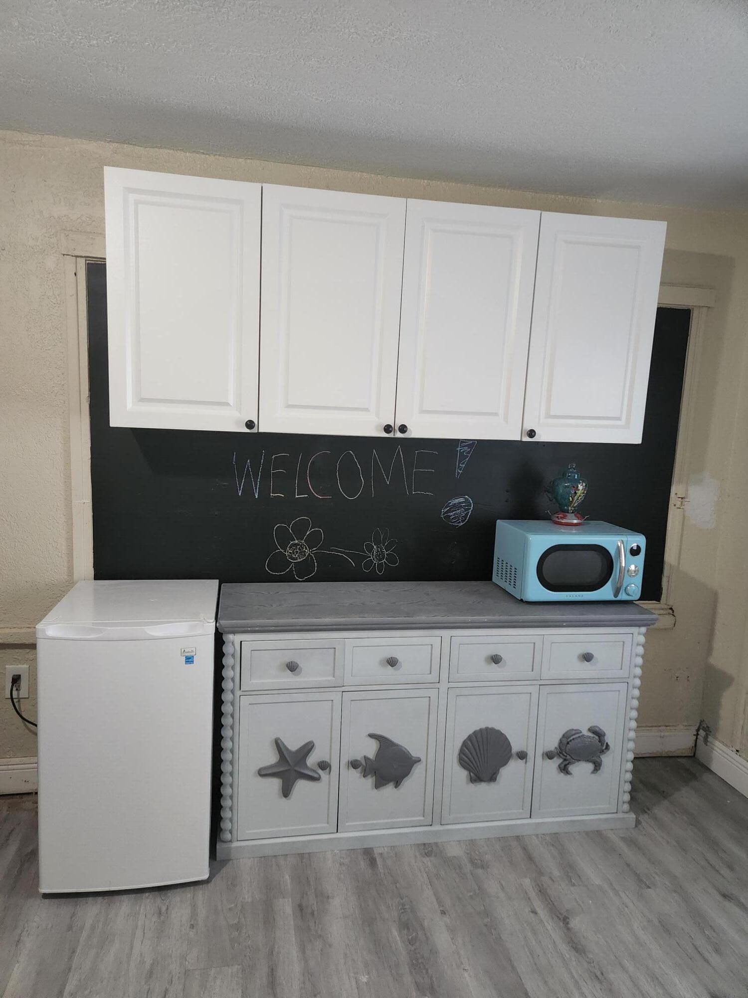 159 East 24th Street Riviera Beach, FL 33404 - Photo 10 of 27 Fridge/Microwave 2nd Side