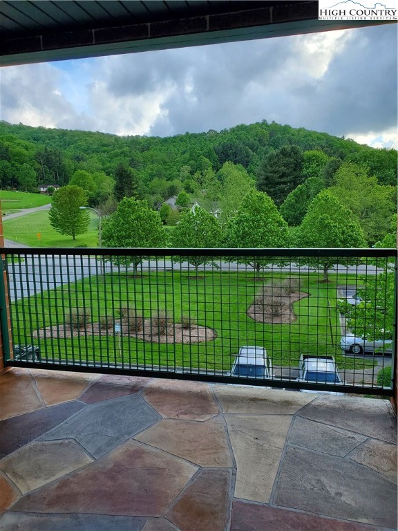 143 Sports Club Lane, Unit 221 Boone, NC 28607 - Photo 11 of 14 a view of a fence and a lake view