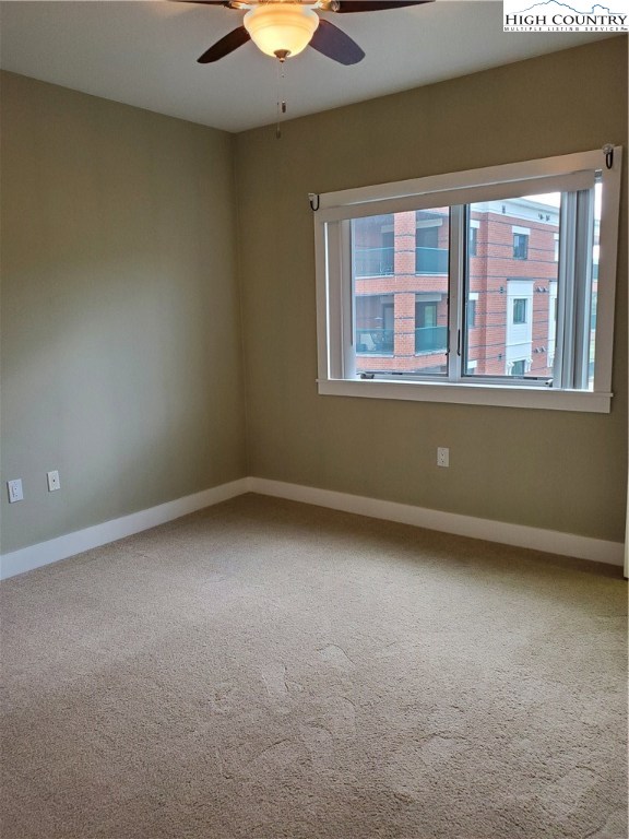 143 Sports Club Lane, Unit 221 Boone, NC 28607 - Photo 6 of 14 an empty room with a window