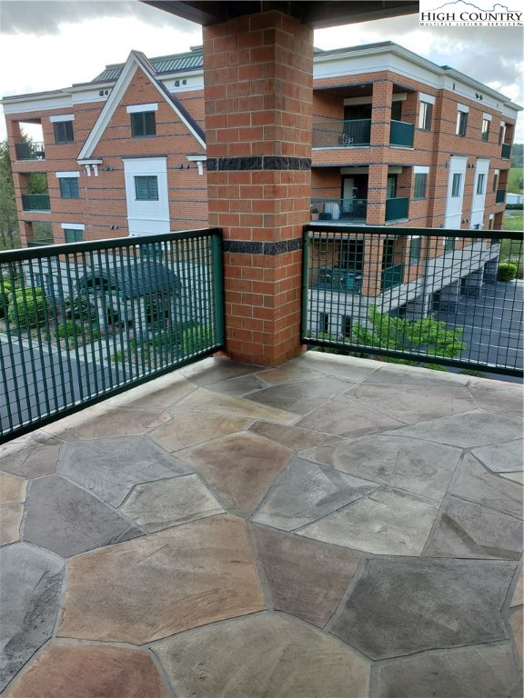143 Sports Club Lane, Unit 221 Boone, NC 28607 - Photo 10 of 14 a view of a brick house with large windows