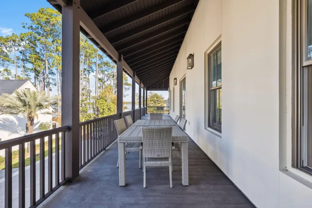 a view of a balcony with wooden floor