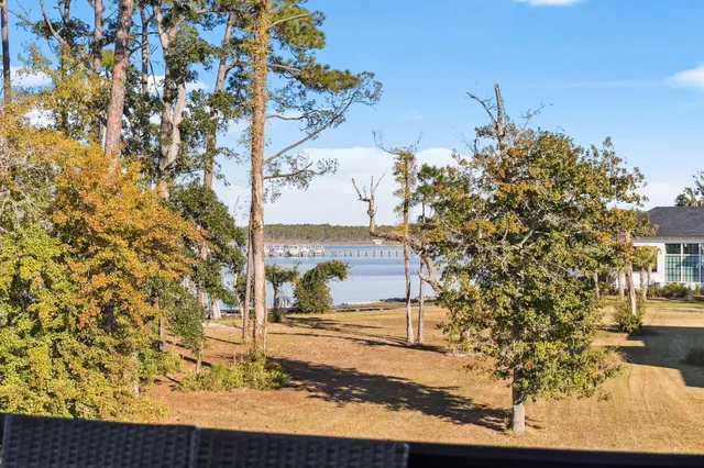 a view of backyard with a deck and wooden floor