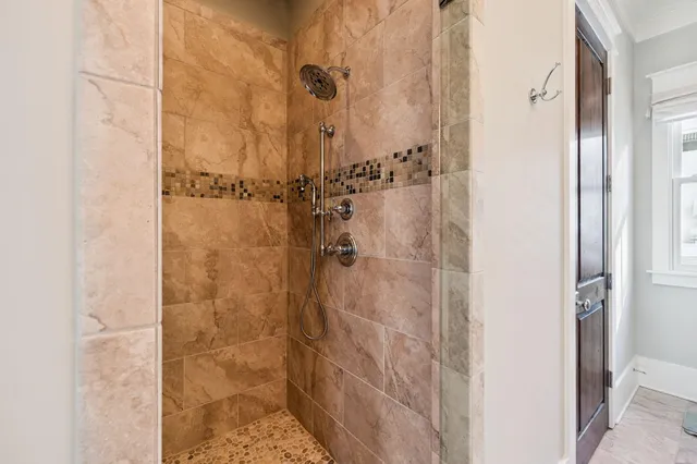 a bathroom with a bathtub and shower
