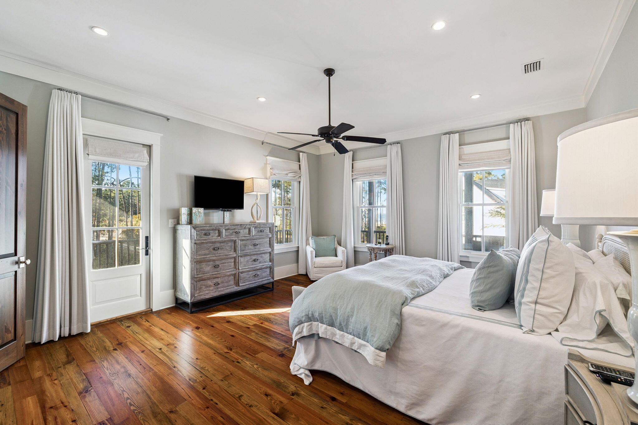 69 Bennett Santa Rosa Beach, FL 32459 - Photo 24 of 58 a spacious bedroom with a bed and a flat screen television