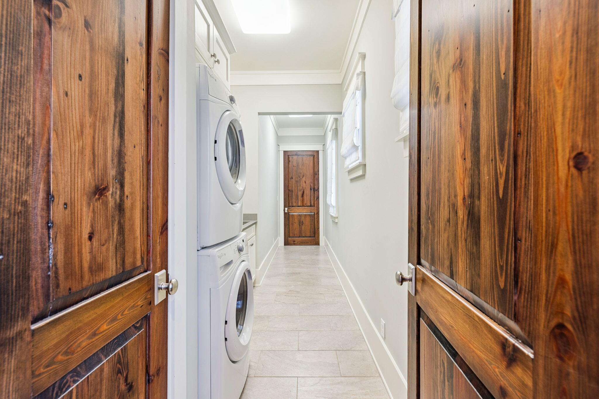 69 Bennett Santa Rosa Beach, FL 32459 - Photo 29 of 58 a view of a hallway with wooden floor and staircase