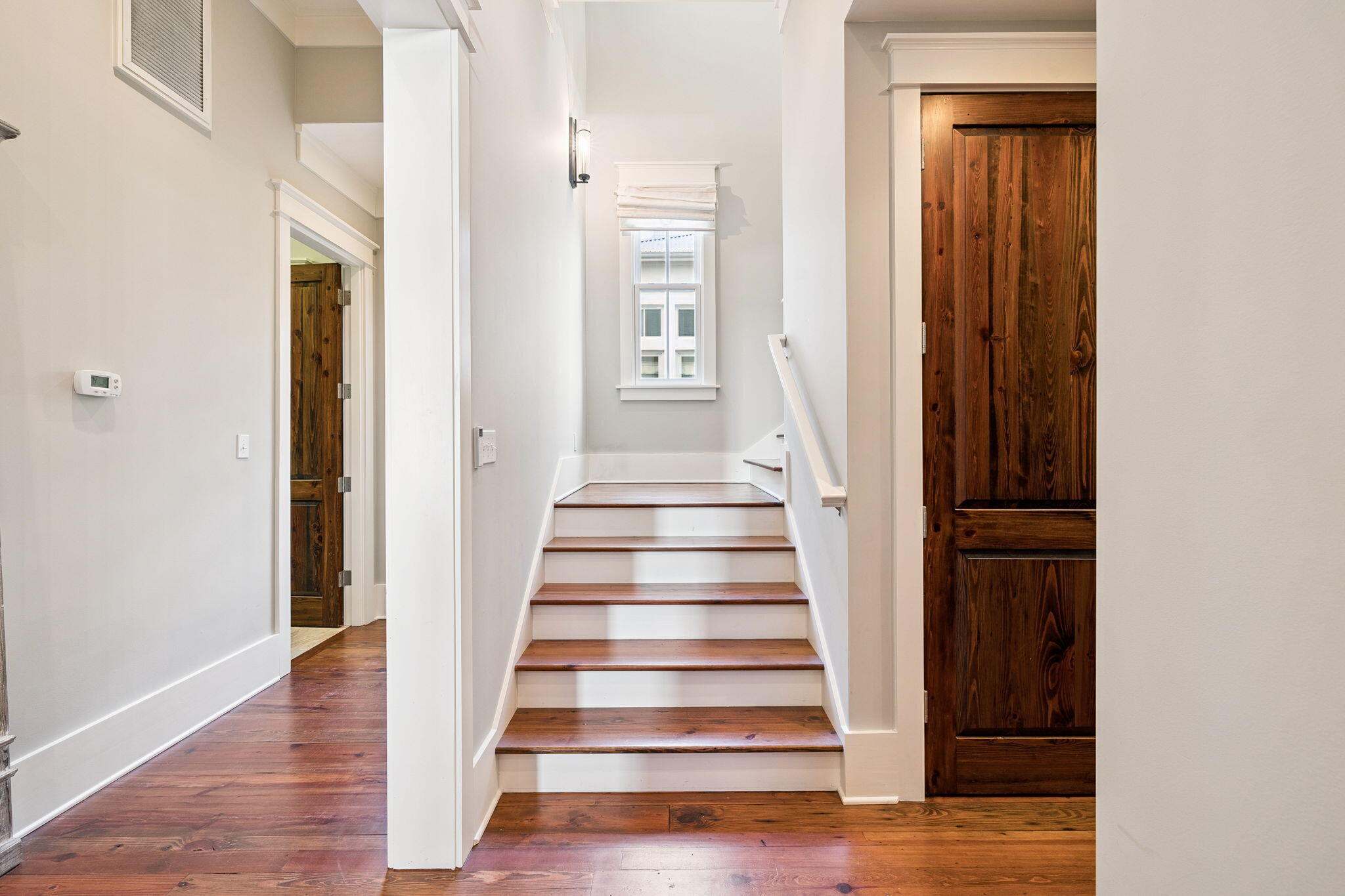 69 Bennett Santa Rosa Beach, FL 32459 - Photo 30 of 58 a view of an entryway with wooden floor and stairs