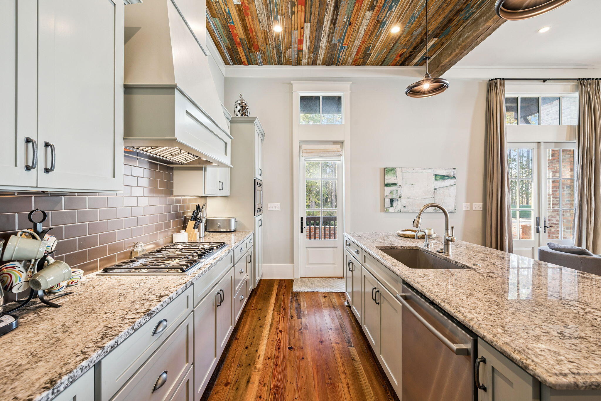 69 Bennett Santa Rosa Beach, FL 32459 - Photo 34 of 58 a kitchen with granite countertop stainless steel appliances a sink stove top oven and cabinets