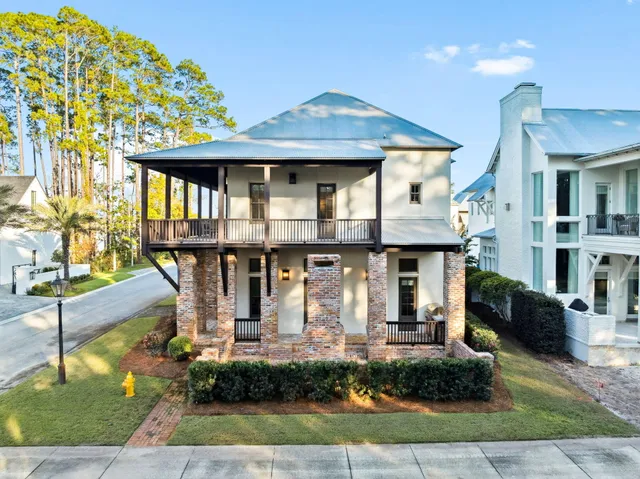 an aerial view of a swimming pool with outdoor seating
