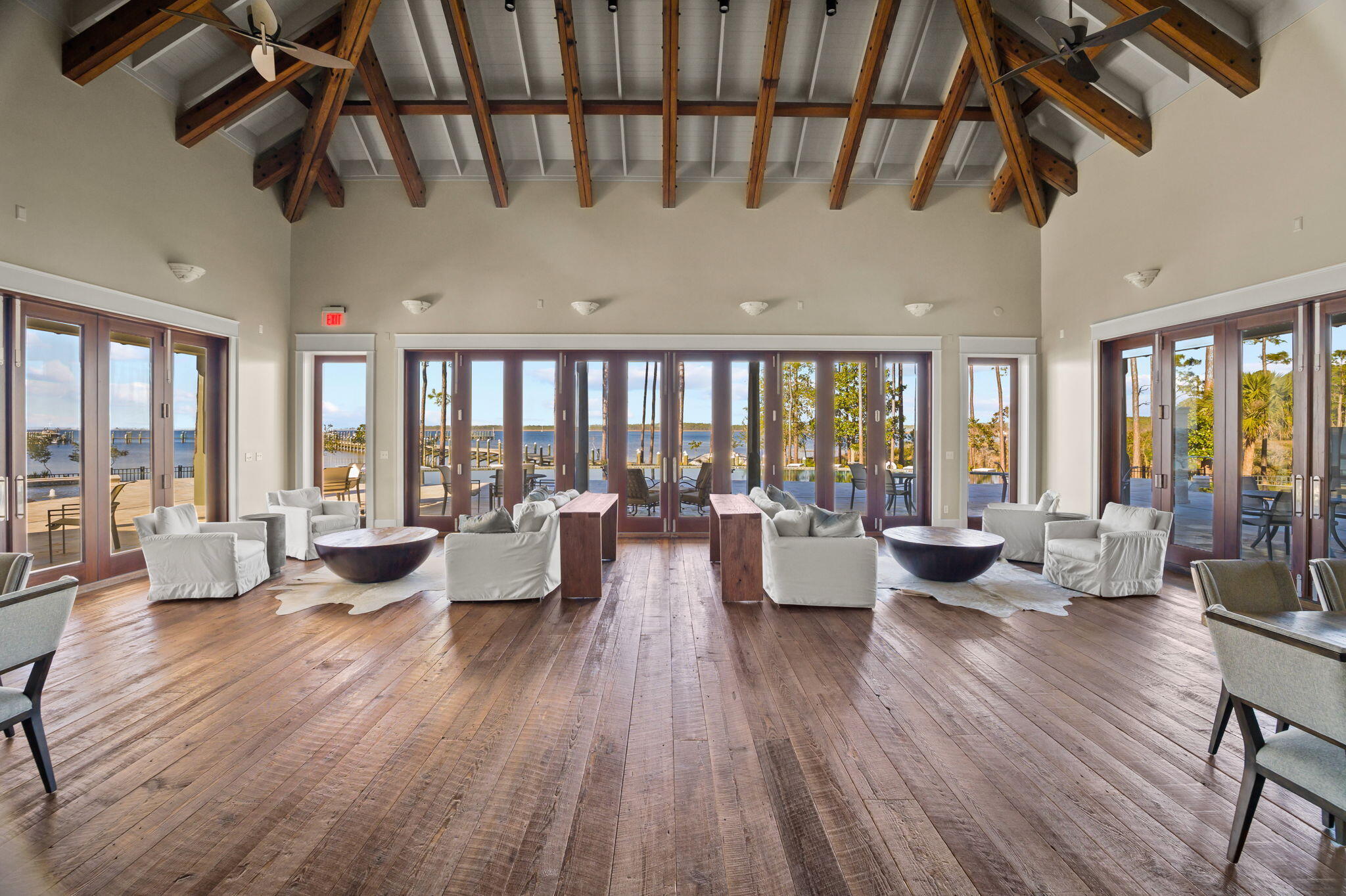 69 Bennett Santa Rosa Beach, FL 32459 - Photo 56 of 58 a living room with furniture floor to ceiling window and wooden floor