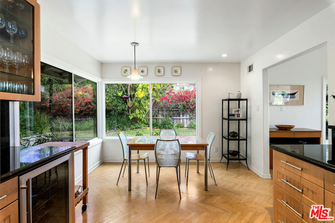 1336 Las Canoas Road Pacific Palisades, CA 90272 - Photo 16 of 37 a very nice looking room with a large window and dining table