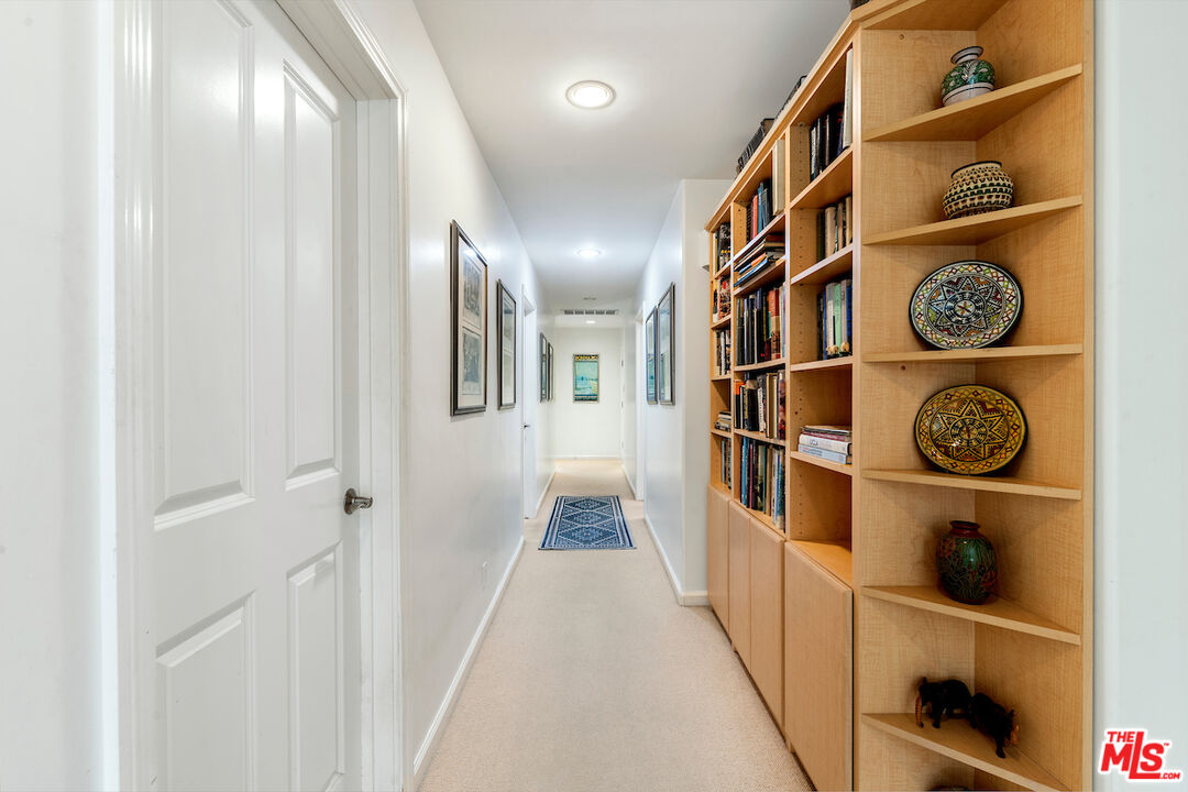 1336 Las Canoas Road Pacific Palisades, CA 90272 - Photo 18 of 37 a view of a hallway with front door