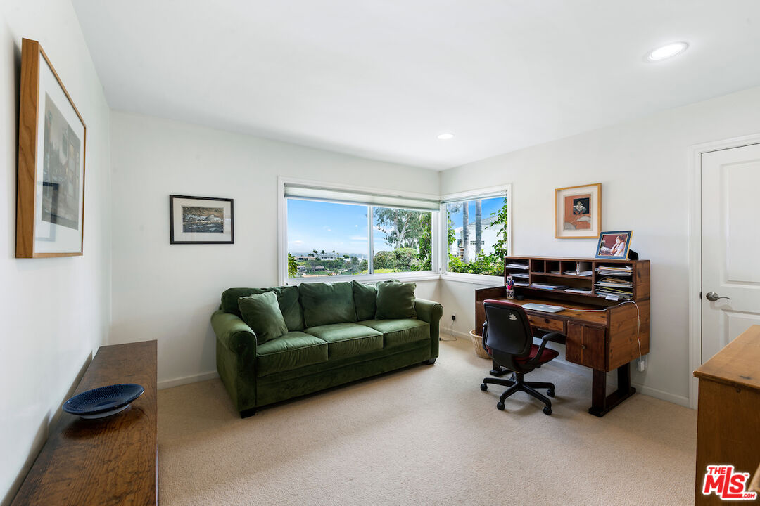 1336 Las Canoas Road Pacific Palisades, CA 90272 - Photo 21 of 37 a living room with furniture and a piano