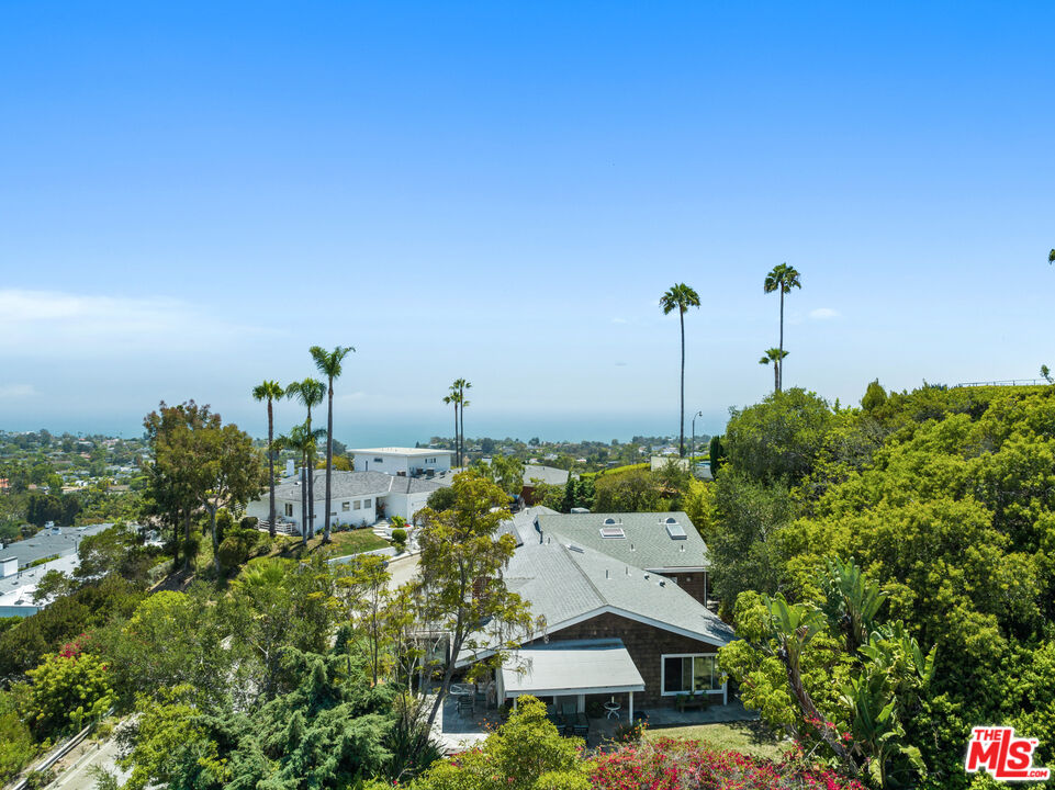 1336 Las Canoas Road Pacific Palisades, CA 90272 - Photo 35 of 37 a aerial view of a house with a yard and plants