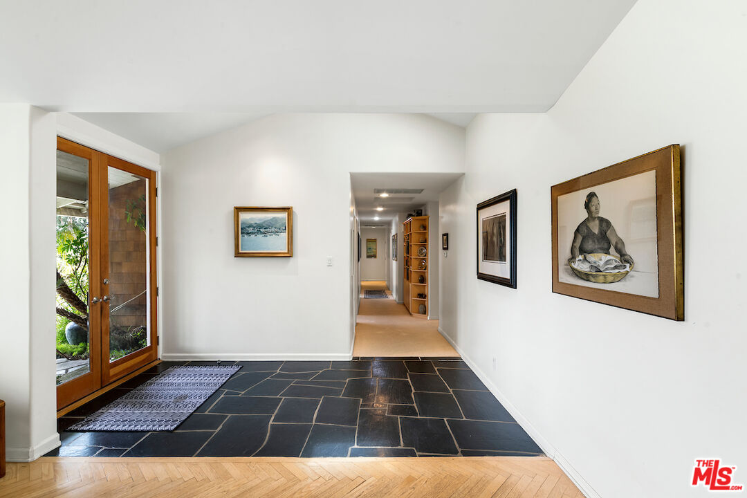1336 Las Canoas Road Pacific Palisades, CA 90272 - Photo 8 of 37 a view of an empty room with painting on the wall