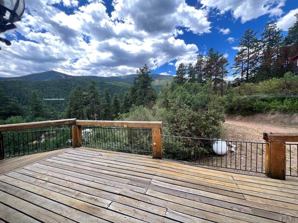 105 St Charles Avenue Rye, CO 81069 - Photo 13 of 35 a view of balcony with wooden floor and fence