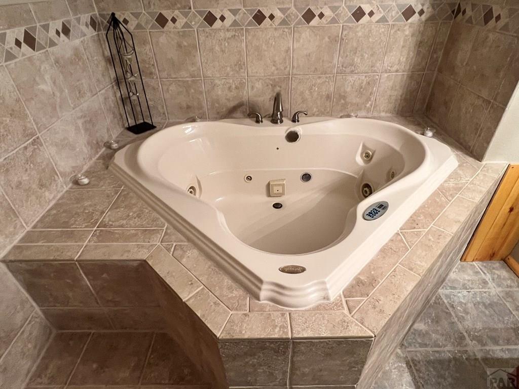 105 St Charles Avenue Rye, CO 81069 - Photo 19 of 35 a bathroom with a tub and shower