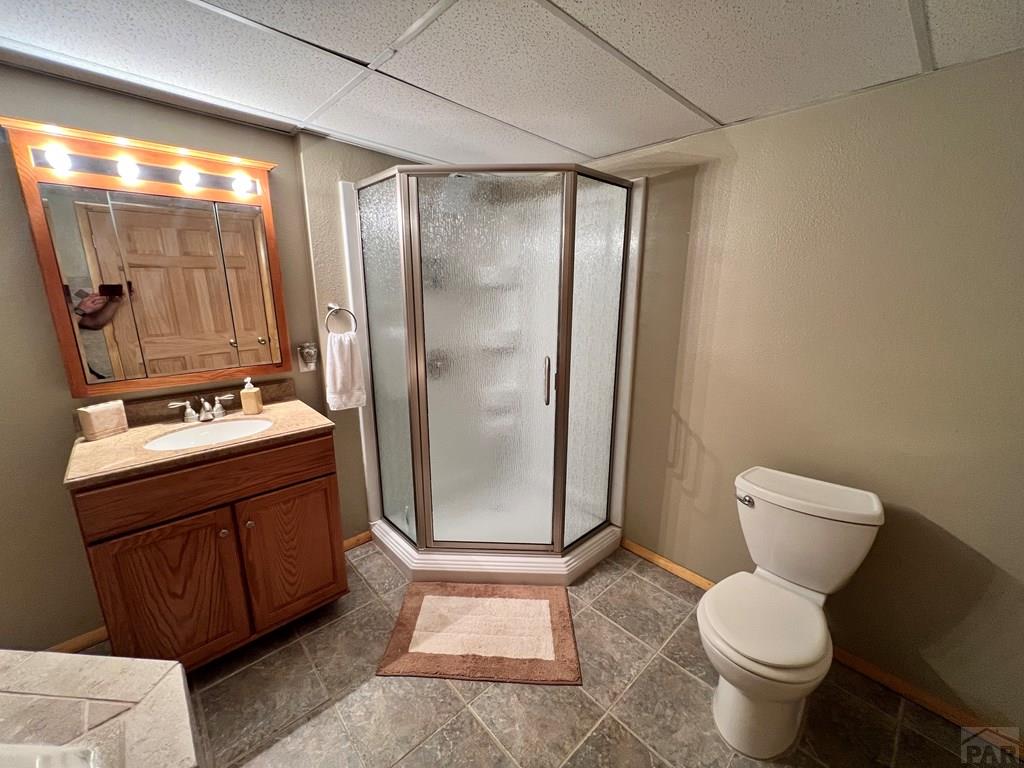 105 St Charles Avenue Rye, CO 81069 - Photo 20 of 35 a bathroom with a granite countertop sink toilet and shower