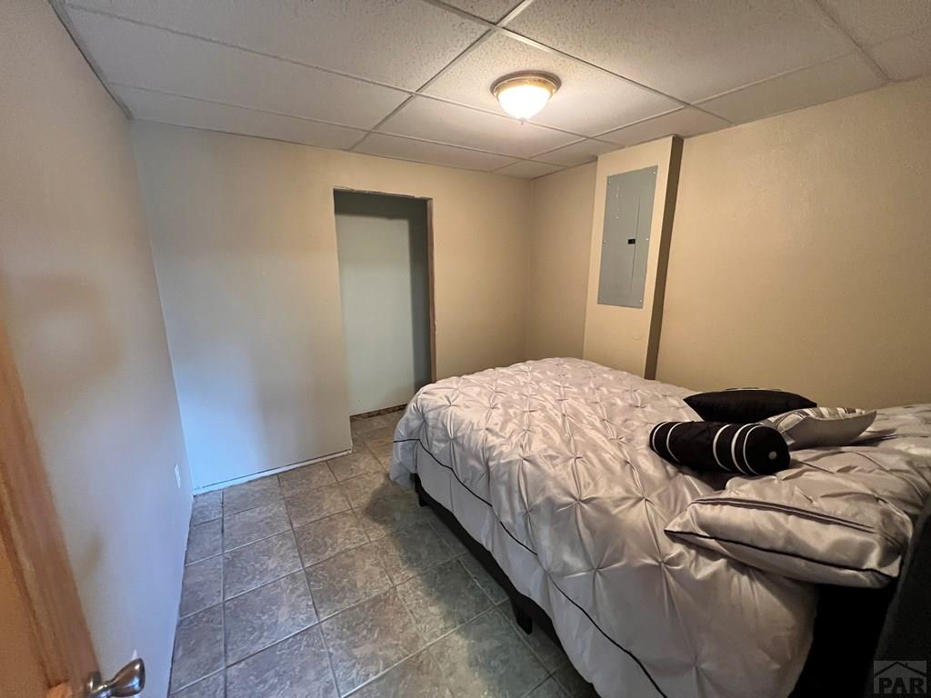 105 St Charles Avenue Rye, CO 81069 - Photo 24 of 35 a bedroom with a bed and a shower