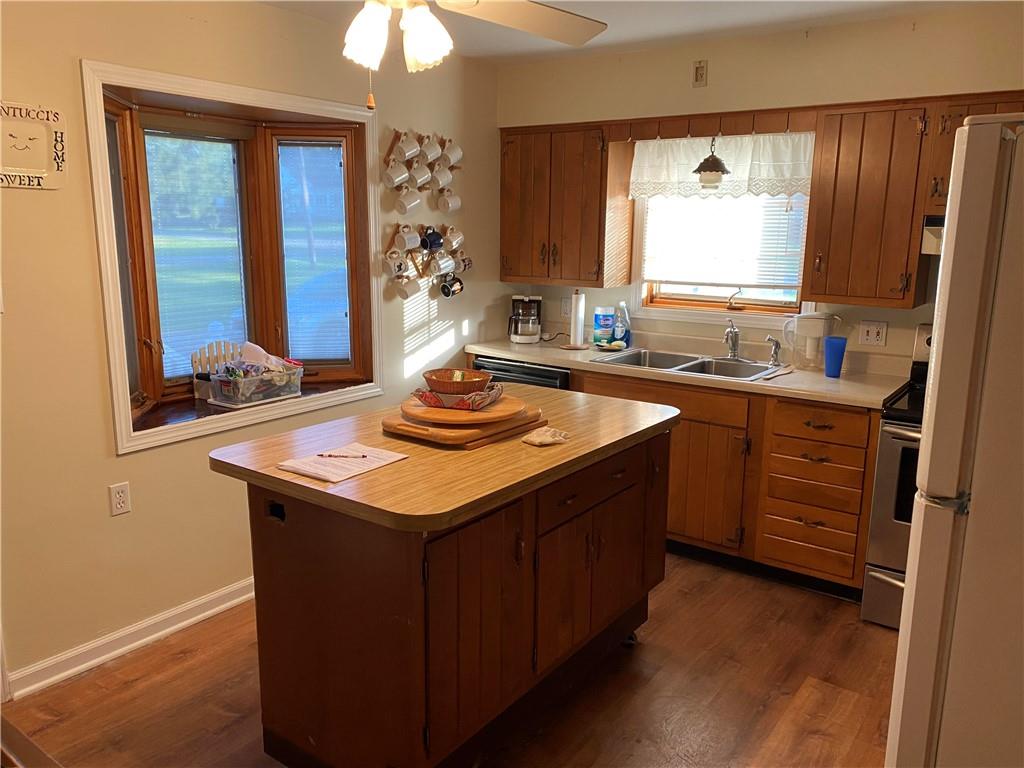 595 Golf Course Road Aliquippa, PA 15001 - Photo 13 of 21 a kitchen with a sink stove and cabinets