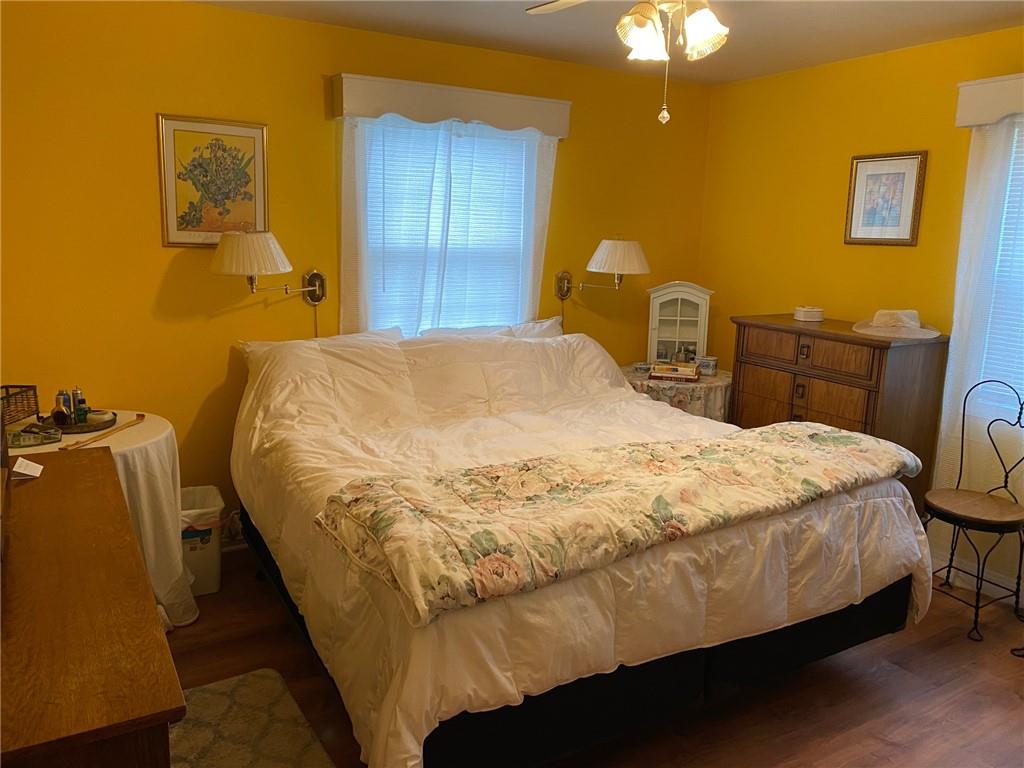 595 Golf Course Road Aliquippa, PA 15001 - Photo 15 of 21 a bed sitting in a bedroom next to a lamp