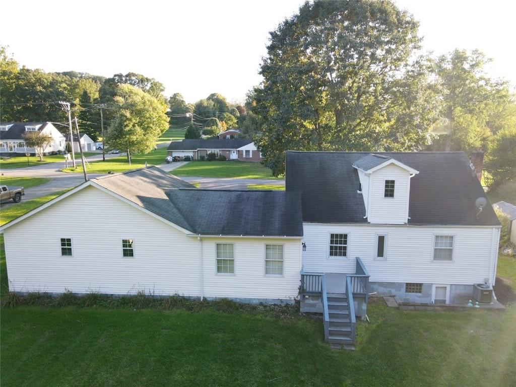 595 Golf Course Road Aliquippa, PA 15001 - Photo 4 of 21 an aerial view of a house with a garden and swimming pool