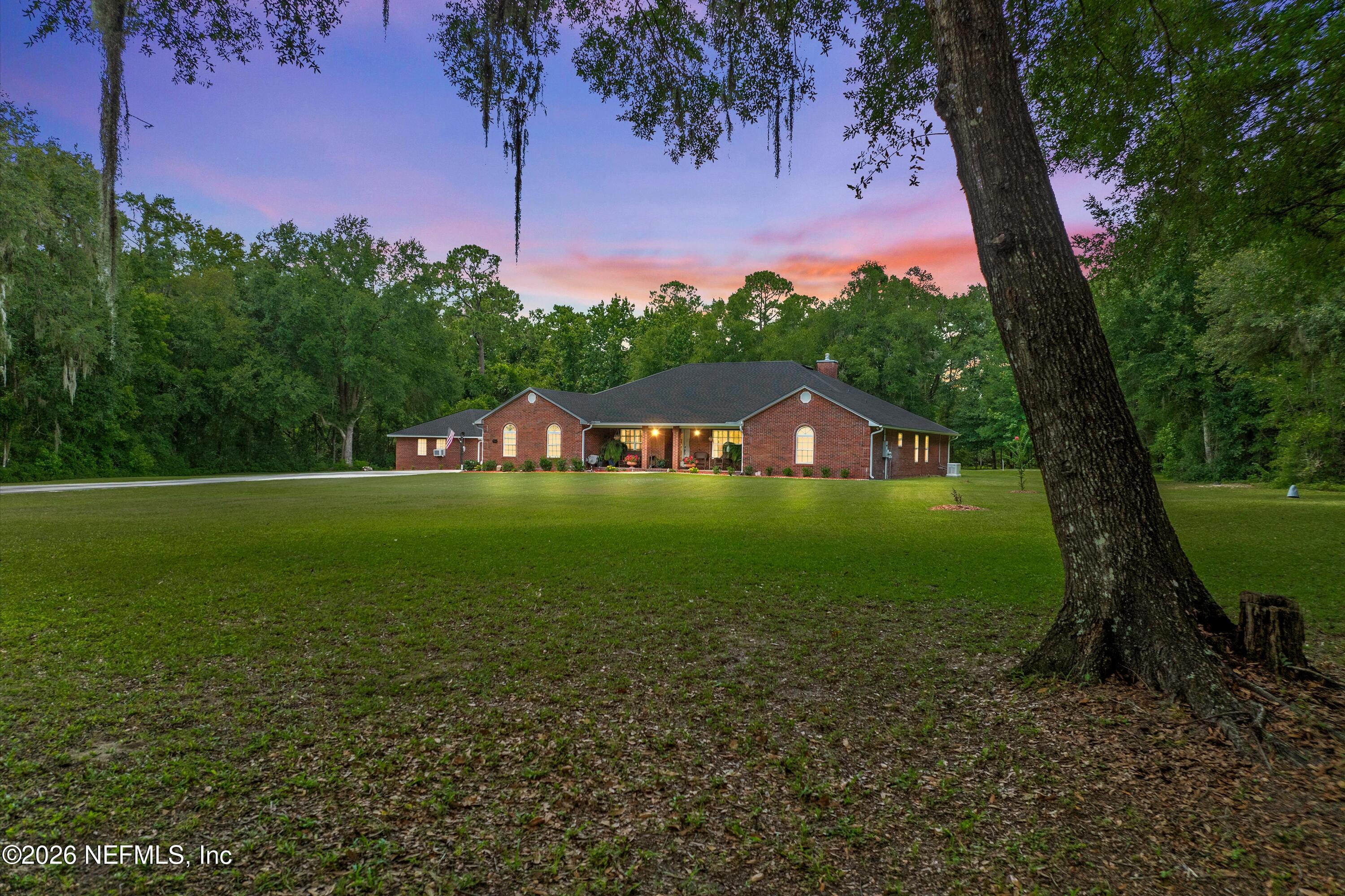 5566 Don Manuel Road Elkton, FL 32033 - Photo 1 of 47 a green field with lots of tress in it