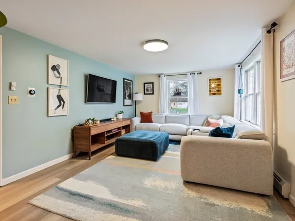 a living room with furniture and a large window