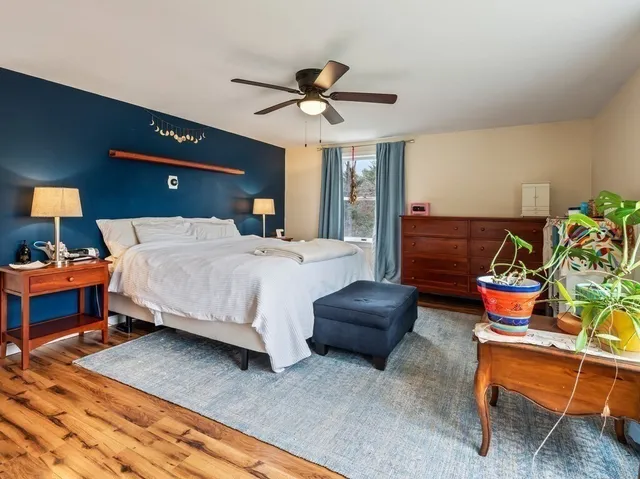 a bedroom with a bed and a dresser