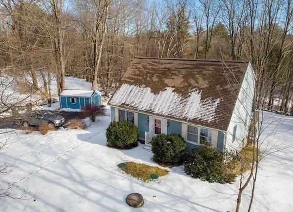 a view of house with yard