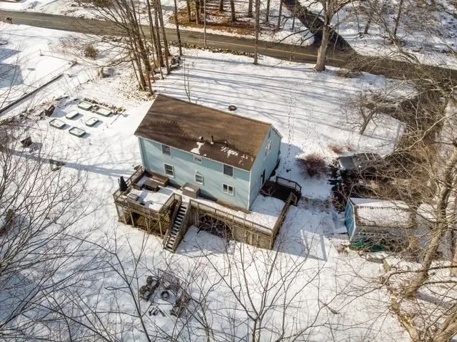 a view of balcony with wooden floor and outdoor seating