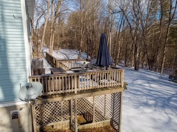 a kitchen with stainless steel appliances a refrigerator sink and wooden floor