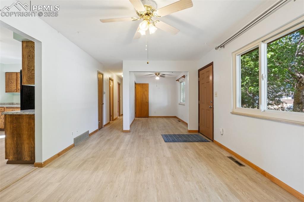 3709 Anemone Circle Colorado Springs, CO 80918 - Photo 11 of 32 a view of empty room with wooden floor and fan