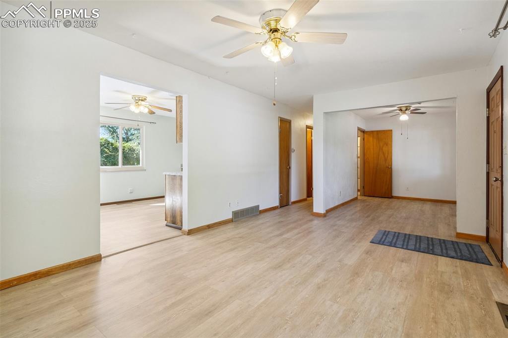 3709 Anemone Circle Colorado Springs, CO 80918 - Photo 13 of 32 wooden floor in an empty room with a window