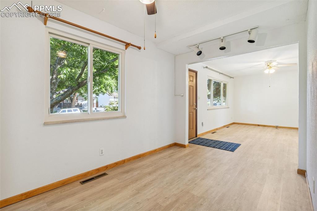 3709 Anemone Circle Colorado Springs, CO 80918 - Photo 15 of 32 a view of empty room with wooden floor and fan