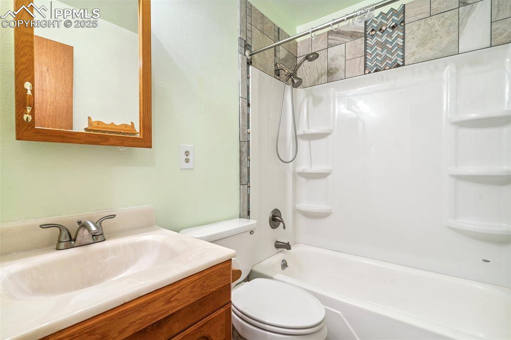 3709 Anemone Circle Colorado Springs, CO 80918 - Photo 24 of 32 a bathroom with a sink a toilet and shower