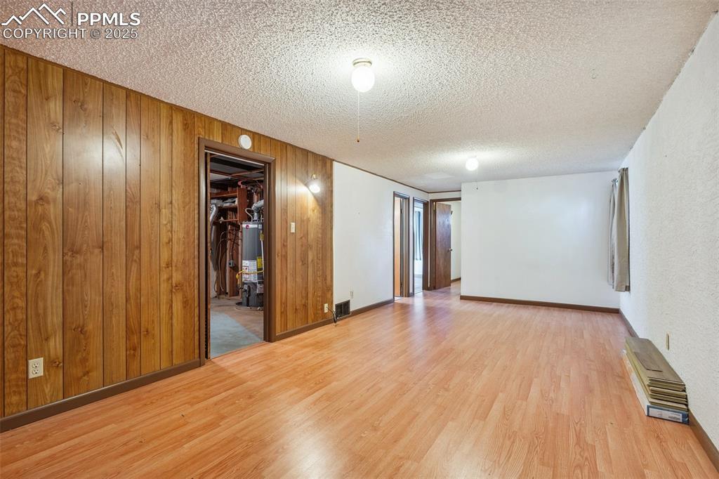 3709 Anemone Circle Colorado Springs, CO 80918 - Photo 25 of 32 a view of a hallway with wooden floor