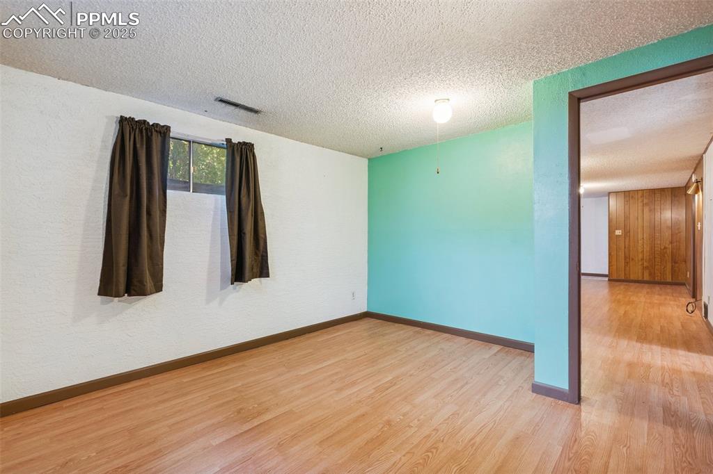 3709 Anemone Circle Colorado Springs, CO 80918 - Photo 28 of 32 a view of a room with wooden floor and a window