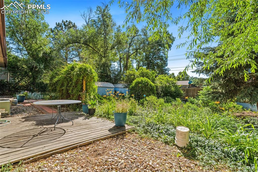 3709 Anemone Circle Colorado Springs, CO 80918 - Photo 32 of 32 a view of a backyard with sitting area