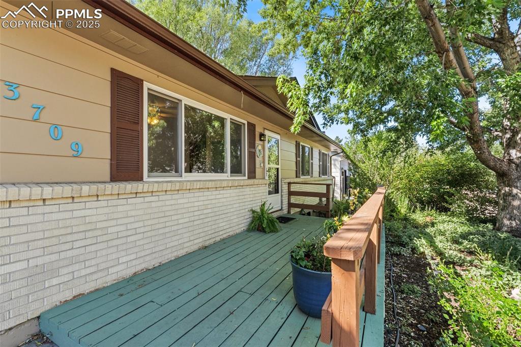 3709 Anemone Circle Colorado Springs, CO 80918 - Photo 8 of 32 a view of house with backyard outdoor seating and wooden floor
