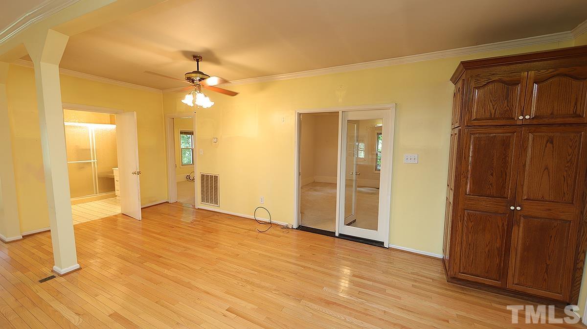 1390 Sanders Road Benson, NC 27504 - Photo 5 of 22 wooden floor in an empty room with a window