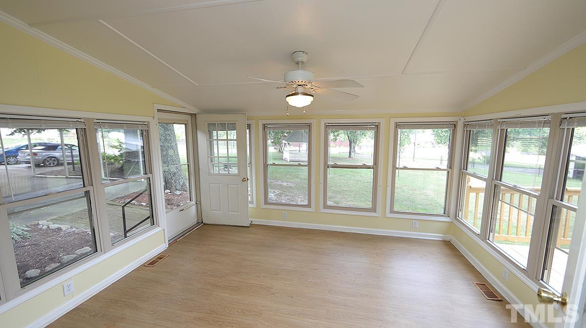 1390 Sanders Road Benson, NC 27504 - Photo 8 of 22 a view of an empty room with a window