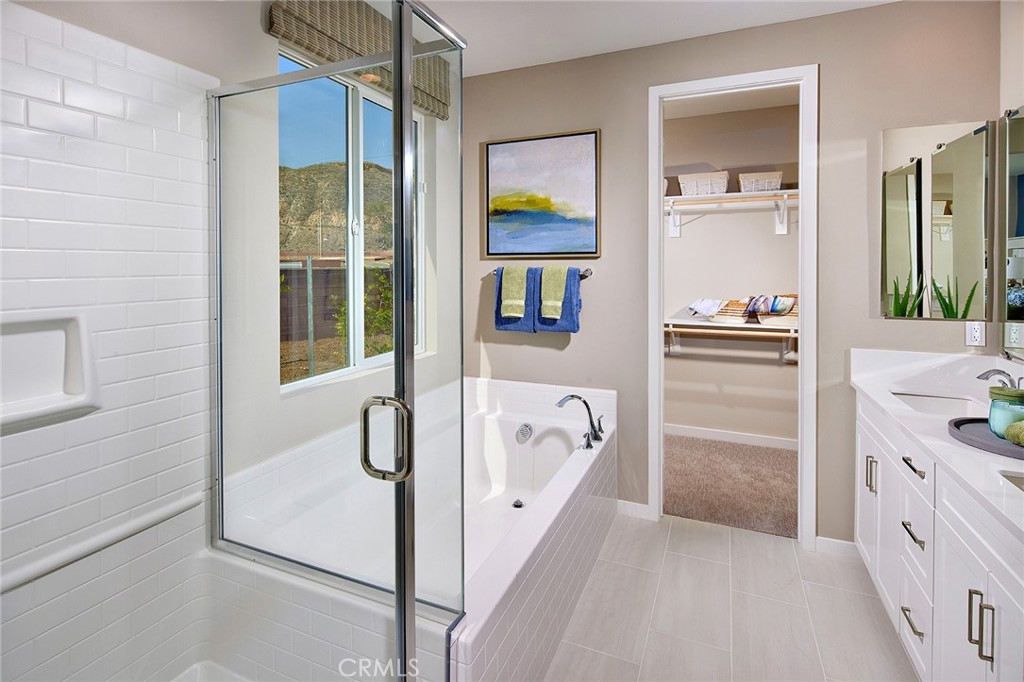 30934 Campania Road Highland, CA 92346 - Photo 11 of 19 a bathroom with a tub sink and mirror