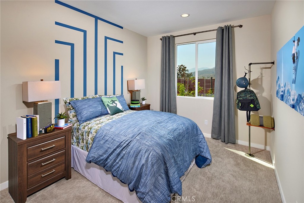 30934 Campania Road Highland, CA 92346 - Photo 15 of 19 a bedroom with a bed and a window