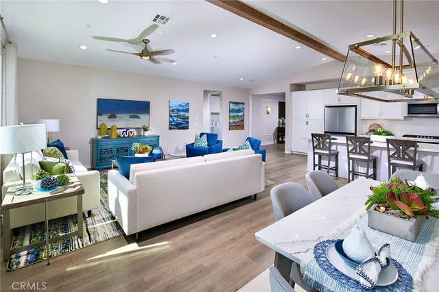 a living room with fireplace furniture and a wooden floor