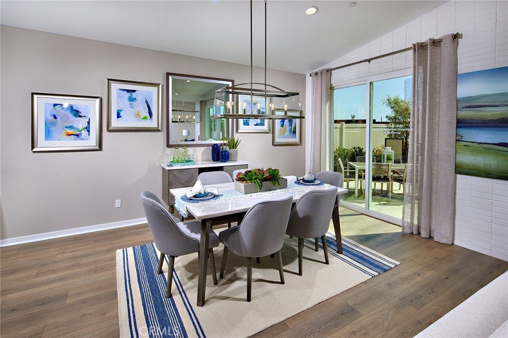 30934 Campania Road Highland, CA 92346 - Photo 5 of 19 a view of a dining room with furniture window and wooden floor