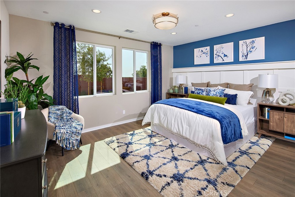 30934 Campania Road Highland, CA 92346 - Photo 9 of 19 a bedroom with a bed and a chair