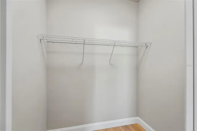 a kitchen with stainless steel appliances kitchen island granite countertop a stove a refrigerator and a microwave