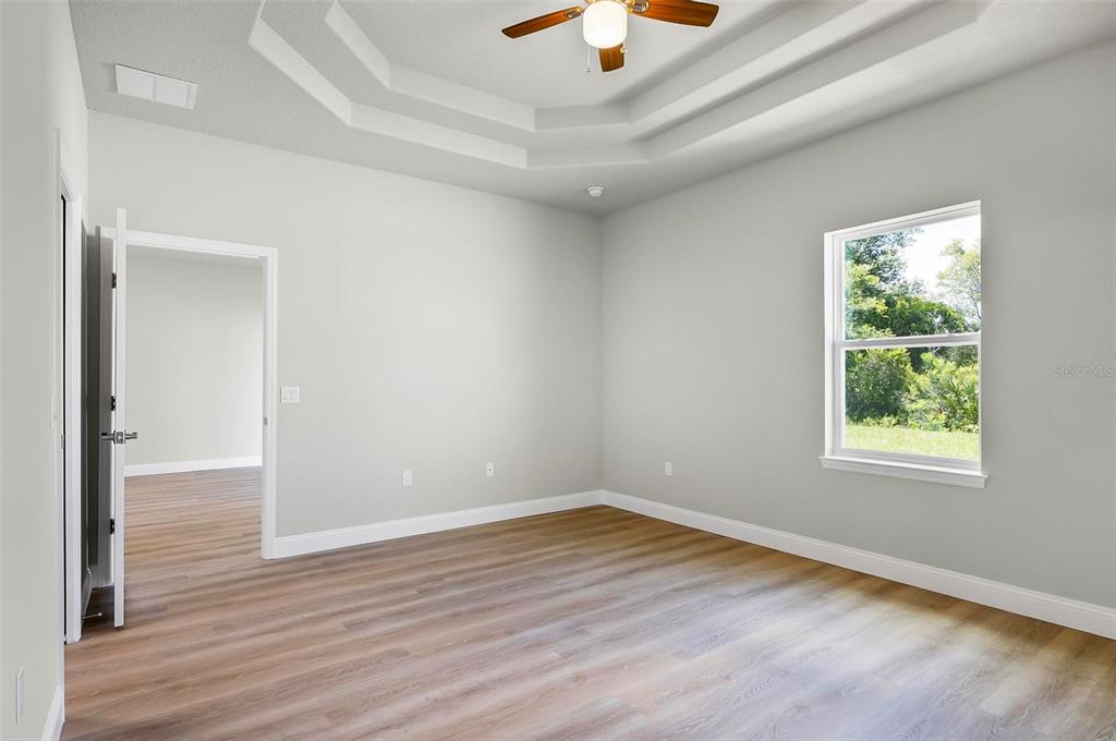 43 Eton Lane, Unit A Palm Coast, FL 32164 - Photo 24 of 78 wooden floor in an empty room with a window