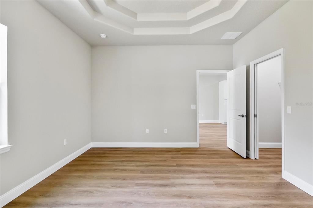 43 Eton Lane, Unit A Palm Coast, FL 32164 - Photo 54 of 78 a view of an empty room with wooden floor